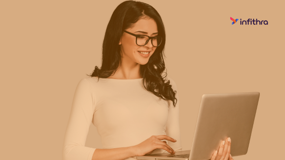 A manager using HR software on laptop and mobile displaying the convenience of HR on the go